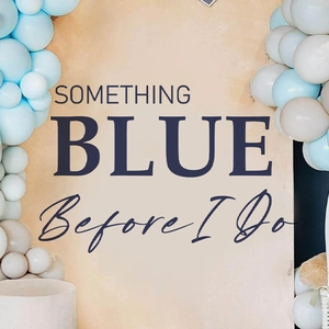 Wedding party backdrop featuring blue Something Blue Before I Do text with balloons