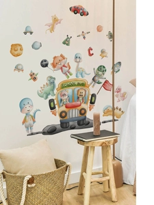 Detail of dinosaur school bus wall stickers in a cozy child room with warm watercolor style