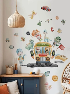 Dinosaur space school bus wall stickers applied on a white wall in a cozy nursery room