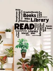 Detalle de pegatinas de pared de PVC con texto negro de biblioteca y motivos verdes