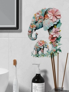 Detailed elephant family wall decal with floral patterns on white bathroom tiles