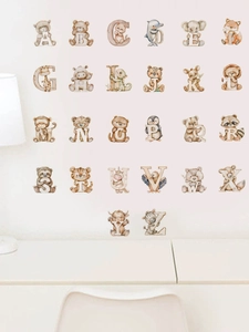 Detailed set of 26 watercolor alphabet wall decals with cute animals on a white wall