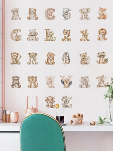 Detailed view of watercolor animal alphabet wall decals in a nursery lifestyle setting