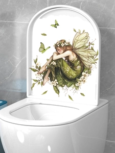 Detail of green fairy wall sticker with butterfly applied to a white toilet lid