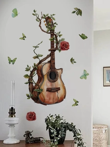 Detail of guitar wall sticker with green vines, red roses and colorful butterflies