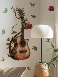 Macro detail of watercolor guitar wall sticker with vines and red roses decoration