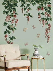 Close-up of pink hanging flowers and butterflies PVC wall decals in a Nordic living room