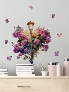 Detail of vintage street lamp wall sticker with purple flowers and butterflies on grey wall