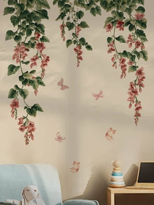 Hanging pink flower wall decals with butterflies in a cozy living room scene