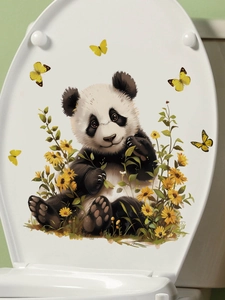 Detail view of cute panda wall stickers with sunflowers and butterflies on a toilet lid