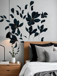 Détail de stickers muraux fleurs noires avec contours dorés dans une chambre moderne