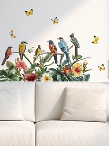 Detail of colorful birds and tropical flowers wall stickers on a modern living room wall