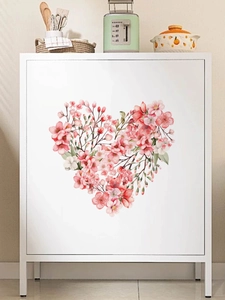 Pink heart-shaped cherry blossom wall decal on a white cabinet for home decoration