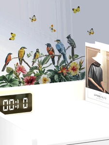 Detail of tropical floral wall stickers with colorful birds and butterflies for home decor