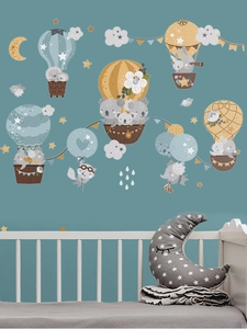 Detail of cartoon animal wall stickers featuring hot air balloons and koalas in nursery