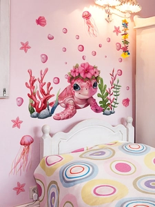 Pink cartoon turtle and coral PVC wall stickers displayed in a cozy pink bedroom setup