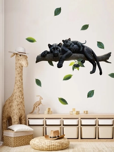 Detail showing black panther and cub wall sticker set with green leaves on wall