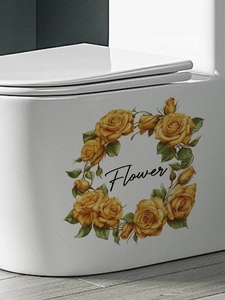 Close-up of yellow rose floral wreath sticker with artistic Flower text on white surface