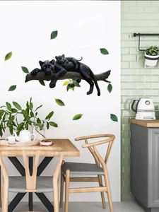 Realistic wall decal featuring two panthers on a branch in a modern dining room setting