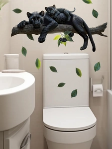 Detailed wall sticker featuring realistic black panthers and green leaves in bathroom decor