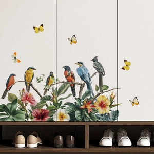 Vibrant birds and floral PVC wall stickers for home decor in a minimalist entryway setting