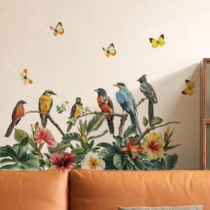 Nature wall stickers with birds and tropical flowers on a modern living room white wall