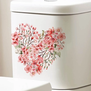 Pink heart-shaped cherry blossom wall stickers on a white toilet tank background