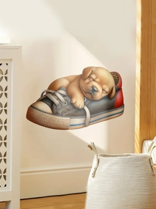 Detailed wall sticker featuring a realistic puppy sleeping inside a canvas sneaker