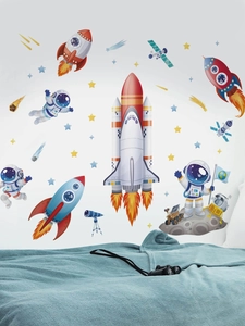 Detailed view of space-themed wall stickers featuring astronauts and rockets in a nursery