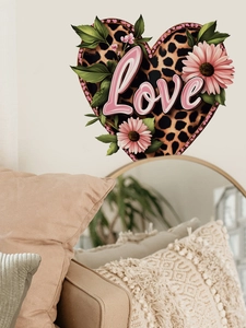 Detail of leopard print heart wall sticker with Love text and pink daisy design