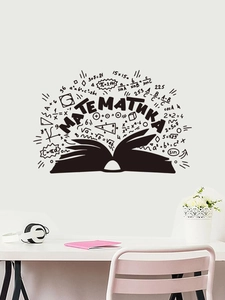 Close-up of black PVC math wall sticker featuring formulas and a book on white wall