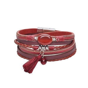 Detail view of multi-layer leather bracelet with red agate stone and magnetic clasp