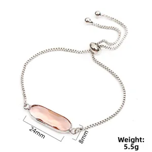 Adjustable silver slider bracelet featuring a 24mm long oval pink crystal pendant