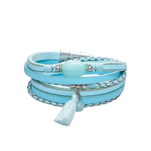 Detail of blue braided leather bracelet featuring vintage stone and magnetic clasp