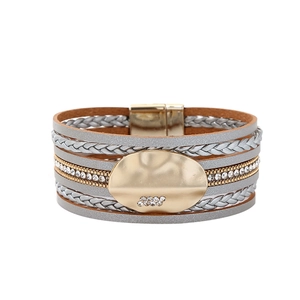 Detail of multi-layer magnetic bracelet with rhinestones and metallic finish