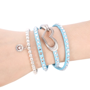 Layered heart bracelet set with rhinestones and Love Me pendant on white background