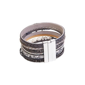 Close-up of bohemian leather wrap bracelet with crystal charms and pearl beads