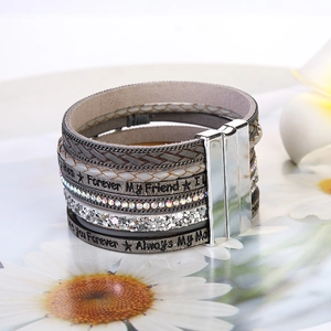 Detail of multi-layer leather bracelet with tree of life and magnetic clasp