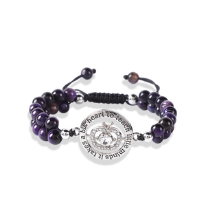 Detail of purple tiger eye beads bracelet with a tree apple pendant and teaching quote