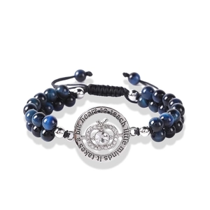 Detail of beaded tiger eye bracelet featuring an engraved silver apple heart teacher pendant