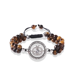 Detail of tiger eye stone bracelet with engraved apple pendant for teachers gift