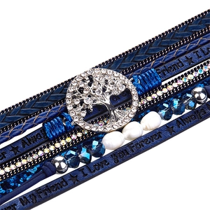 Detail view of blue multilayer leather bracelet with sparkling Tree of Life charm and text