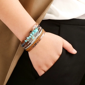 Bohemian multilayer leather bracelet with turquoise stones and silver feather charm