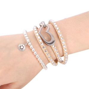 Beaded silver bracelet with love charm and leather wrap bracelet with rhinestone heart