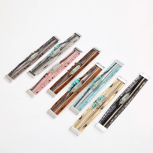 Multilayer leather bracelet with turquoise beads and feather charm on white background