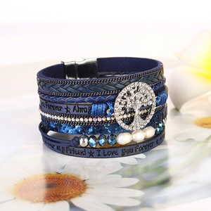 Detailed shot of multi-layer blue leather tree of life bracelet with magnetic clasp