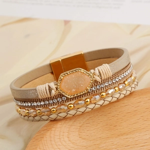 Close-up of bohemian multi-layer crystal bead bracelet with gold magnetic clasp