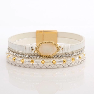 Detailed view of multilayer leather bracelet with crystals and gold magnetic clasp