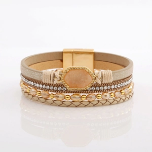 Detail of bohemian multilayer bracelet with rhinestones, crystals and magnetic clasp