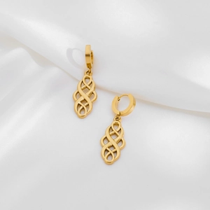 Golden stainless steel Celtic knot earrings on white silk fabric background